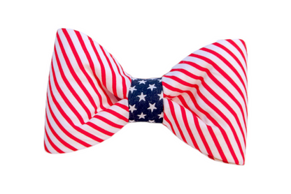 Let your furry friend join in on the patriotic celebrations! This bold and stylish dog bow tie is designed to reflect the spirit of American pride. With vibrant red and white stripes flanking a navy blue center adorned with white stars, this bow tie is perfect for Independence Day, Memorial Day, Veteran's Day, and any day you want to showcase your love for the USA.